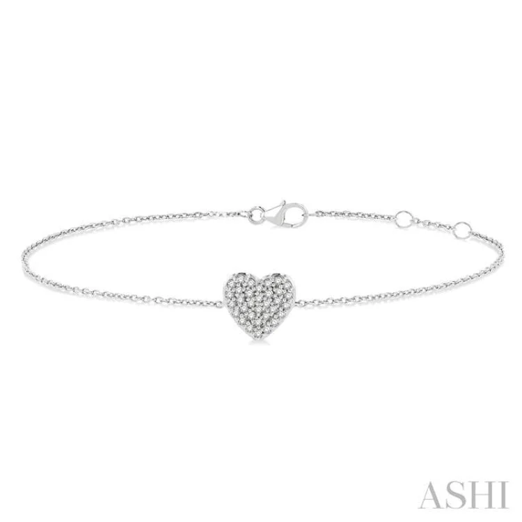 Ladies bracelets trending styles-1/8 ctw Petite Heart Round Cut Diamond Fashion Bracelet in 10K White Gold