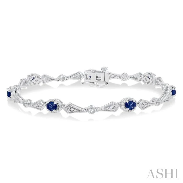 Ladies bracelets sentimental pieces-1/10 ctw Oval Cut 4X3MM Sapphire and Round Cut Diamond Precious Bracelet in 10K White Gold