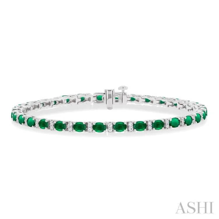 Ladies bracelets gold designs-1/3 ctw Oval Cut 4X3MM Emerald and Round Cut Diamond Precious Bracelet in 14K White Gold