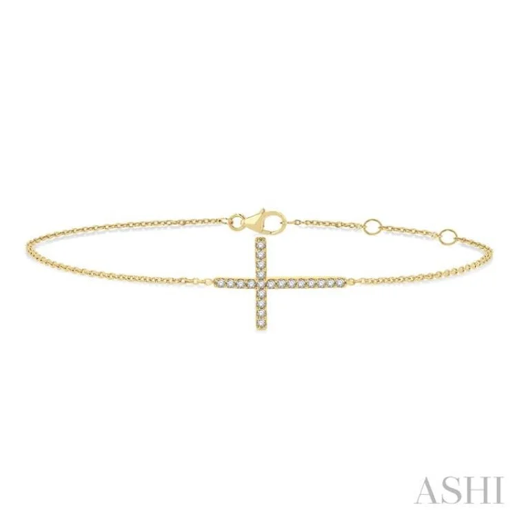 Ladies bracelets fashion trends-1/8 ctw Petite Reclined Cross Round Cut Diamond Fashion Bracelet in 10K Yellow Gold