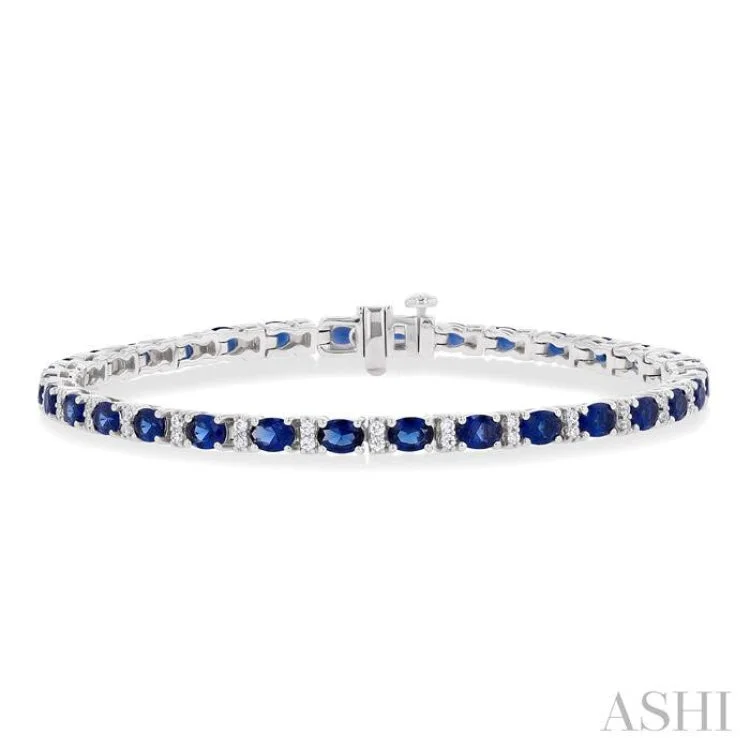 Ladies bracelets geometric shapes-1/3 ctw Oval Cut 4X3MM Sapphire and Round Cut Diamond Precious Bracelet in 14K White Gold