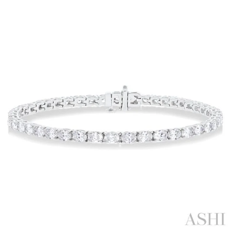 Ladies bracelets popular brands-5 1/2 ctw East West Oval Cut Diamond Fashion Tennis bracelet in 14K White Gold