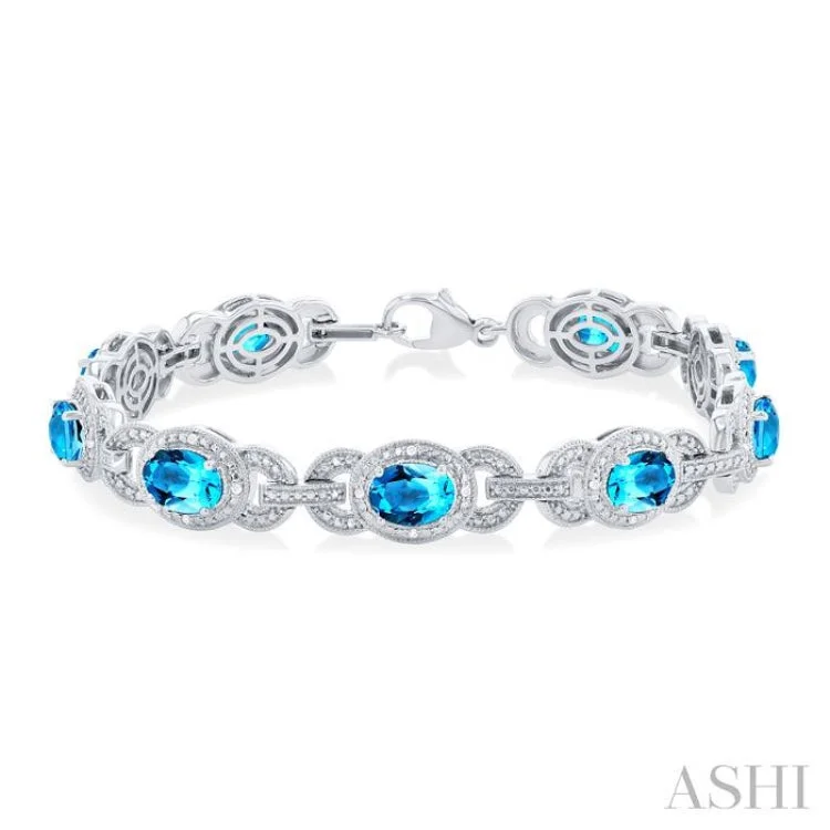 Ladies bracelets Mother’s Day-1/10 ctw Oval Cut 7x5MM Blue Topaz and Round Cut Diamond Semi Precious Bracelet in Sterling Silver